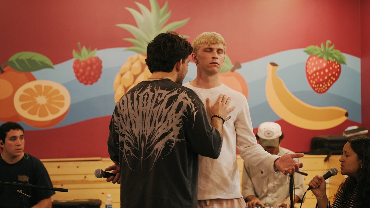 John praying with students